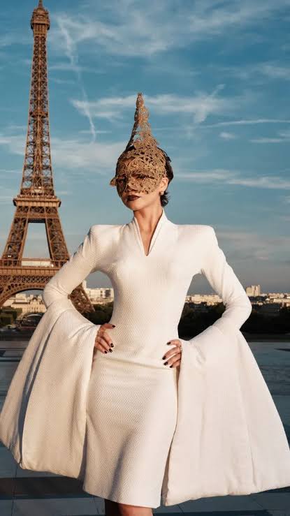 Zendaya at the Eiffel Tower in a gold mask